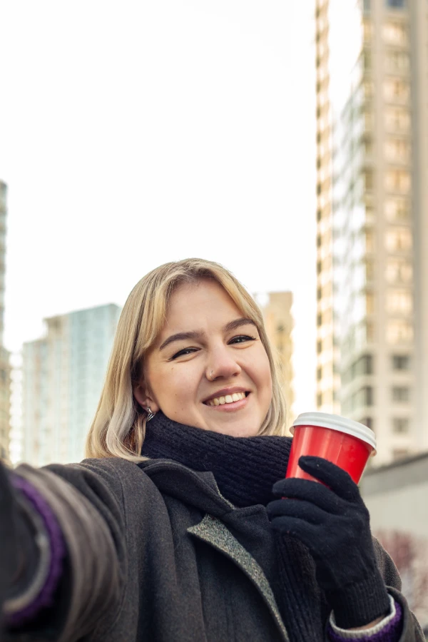 Selfie of a girl holding a cup